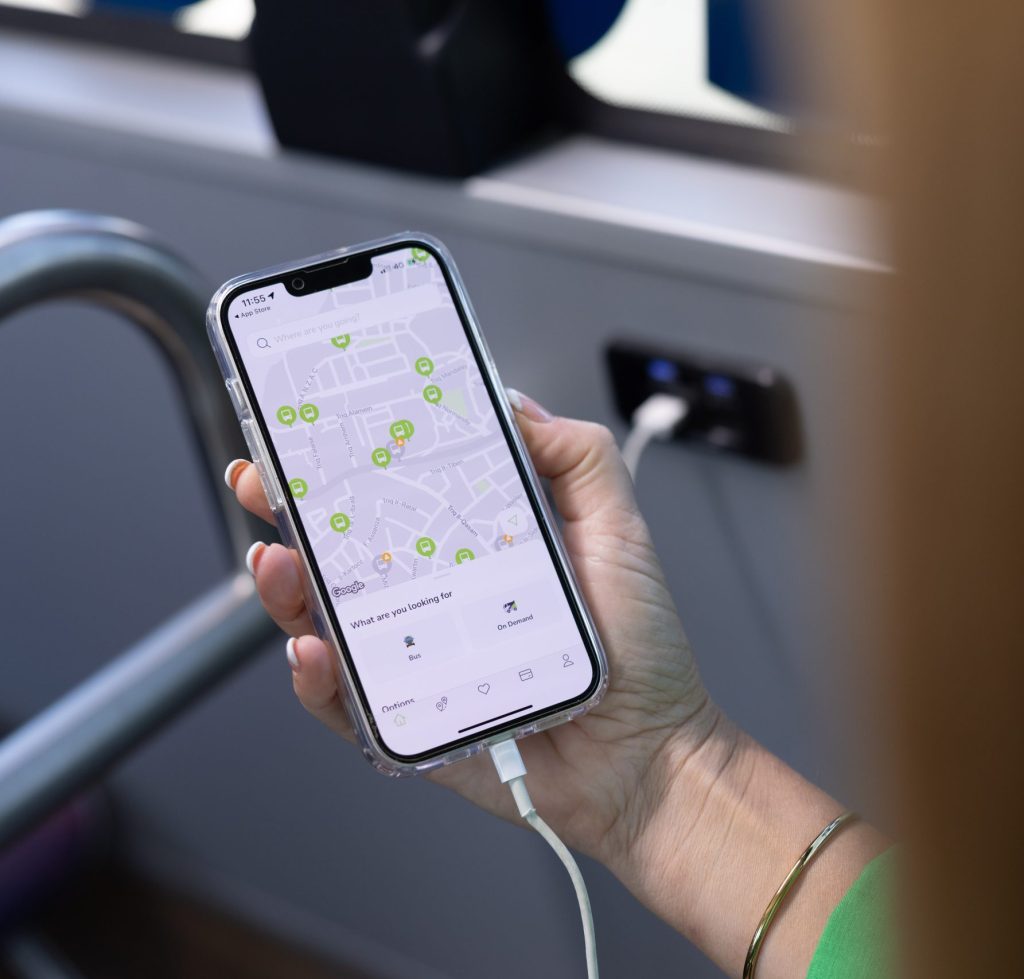 Woman using phone on bus