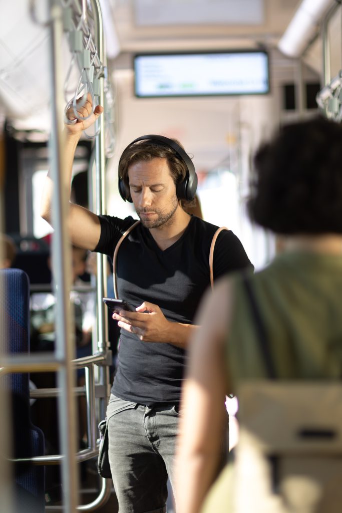 man with phone on the bus man with phone on the bus